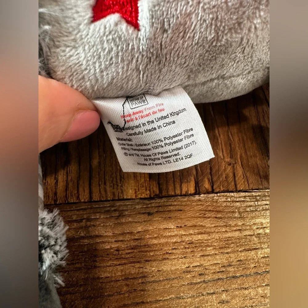 Gray Plush Toy with Red Star and Striped Scarf